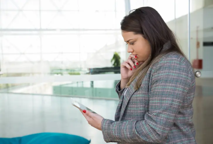 Person pausing before sending message