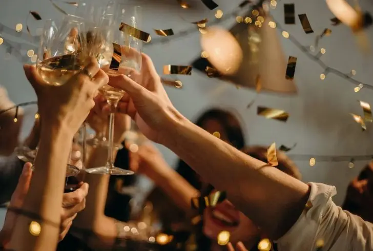 Bubbly champagne glasses clinking in celebration