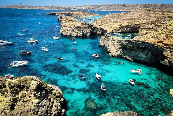 Boat floating on Blue Lagoon waters.